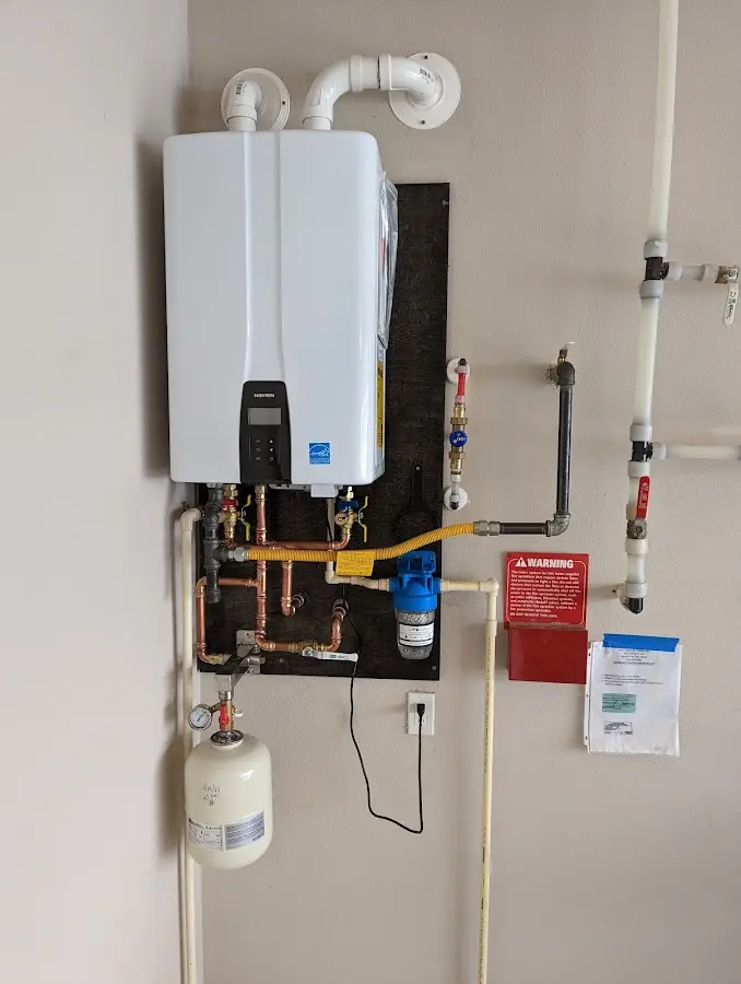 Professional plumber installing copper piping in a Arroyo Grande home